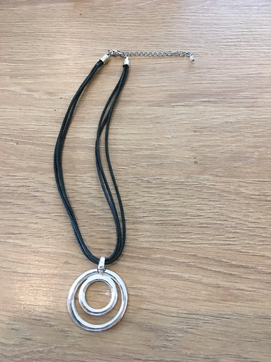 Silver circle w/ black leather cord