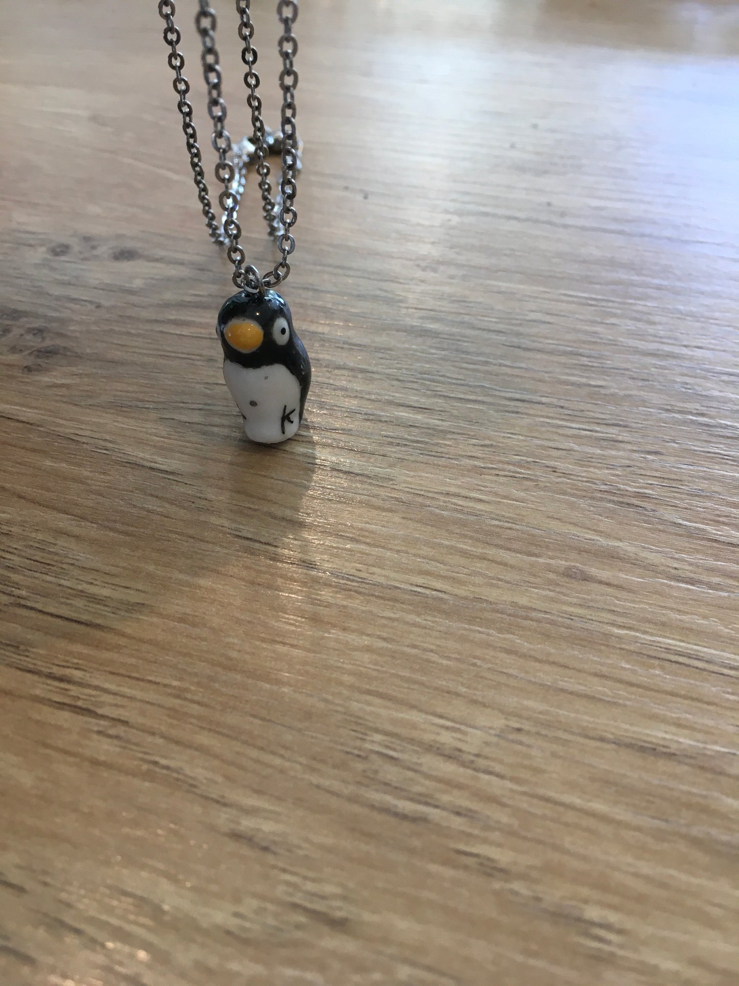 Ceramic penguin pendant on silver chain